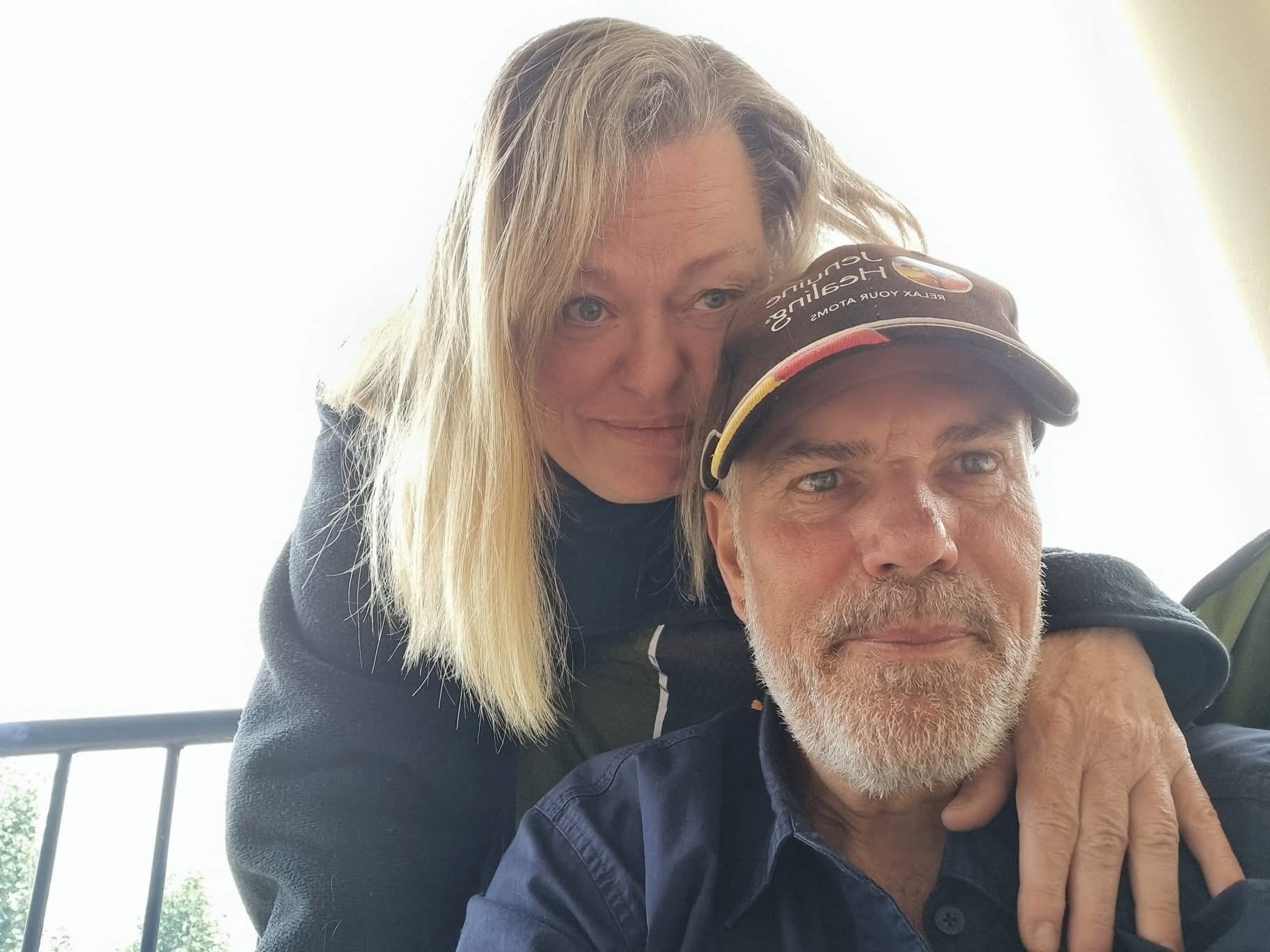 Selfie photo of Jen Ward and Marvin Schneider in work clothes